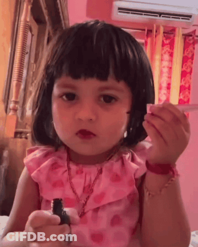 Little Girl In Pink Dress With Lipstick GIF