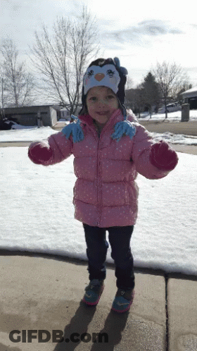Little Girl In Pink Jacket And Penguin Hat GIF