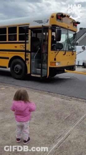 Little Girl In Pink Jacket In Front Of School Bus 1753 GIF