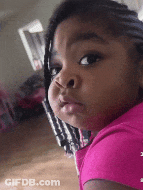 Little Girl In Pink Shirt Making Face GIF