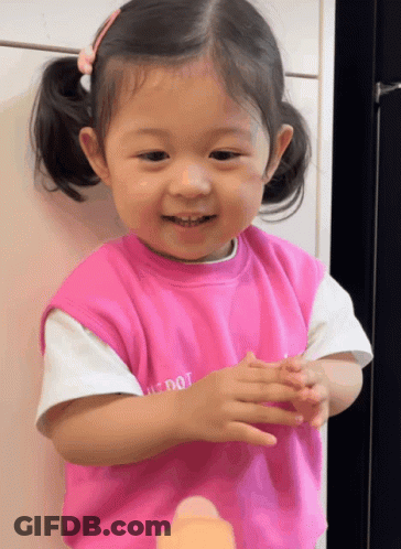 Little Girl In Pink Shirt Saying Just Dot GIF
