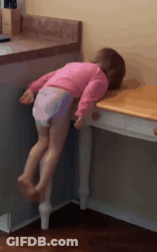 Little Girl In Pink Shirt Standing On Table GIF