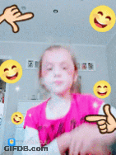 Little Girl In Pink Shirt Surrounded By Yellow Smiley Faces GIF