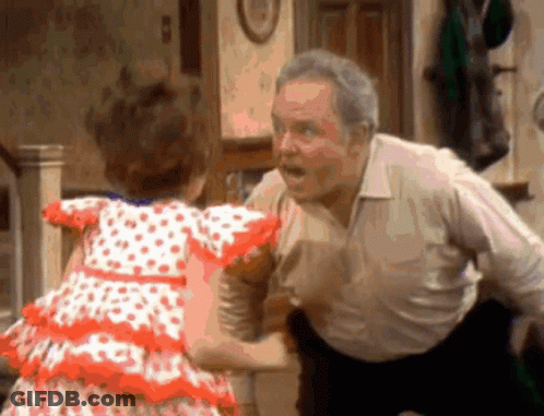 Little Girl In Polka Dot Dress Dancing With Older Man GIF