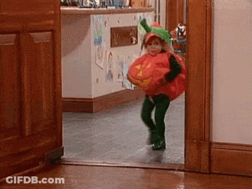 Little Girl In Pumpkin Costume Running Out Of Door GIF