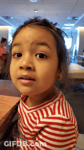 Little Girl In Red And White Striped Shirt Looking GIF