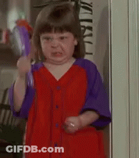 Little Girl In Red Dress Holding Toy Gun GIF