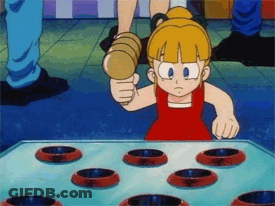 Little Girl In Red Dress Playing Hammer Game GIF