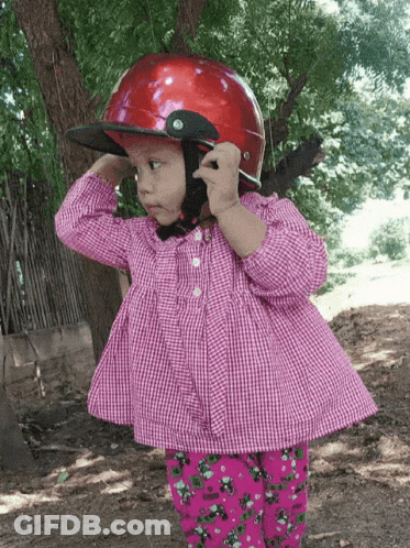 Little Girl In Red Helmet And Plaid Shirt GIF
