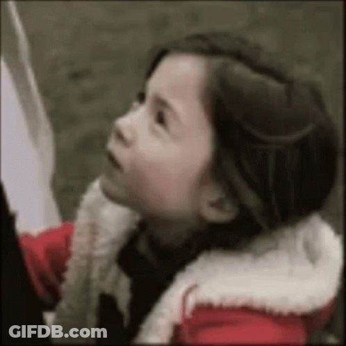 Little Girl In Red Jacket Looking Up GIF
