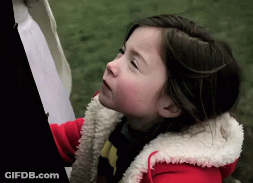Little Girl In Red Jacket With White Furry Hood GIF