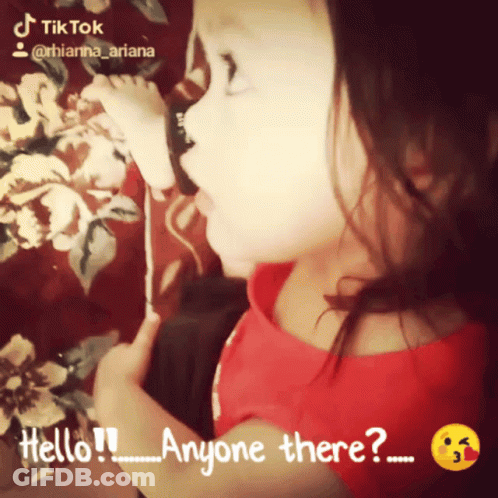 Little Girl In Red Shirt Saying Hello Anyone There GIF