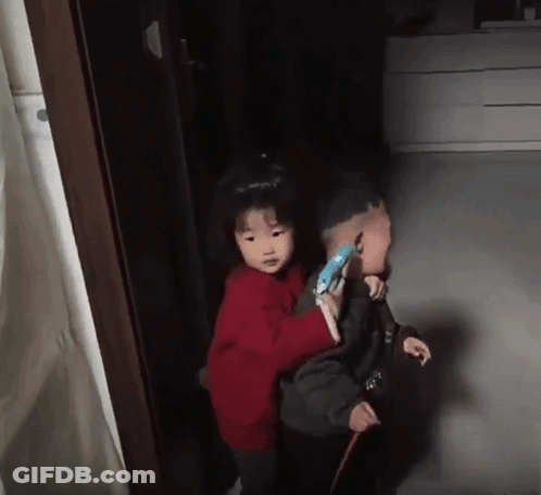 Little Girl In Red Sweater Carrying Boy GIF