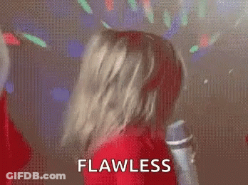 Little Girl In Red Sweater Dancing With Microphone GIF