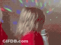 Little Girl In Red Sweater Holding Microphone GIF
