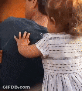 Little Girl In Striped Dress Hugging Man's Back GIF