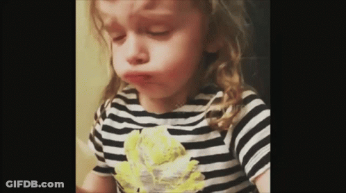 Little Girl In Striped Shirt Making Funny Face GIF
