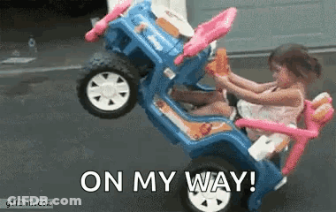 Little Girl In Toy Car Saying On My Way GIF