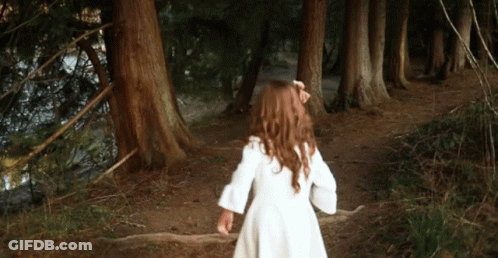 Little Girl In White Dress Running Through Woods GIF