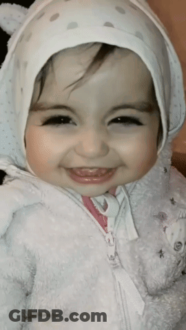 Little Girl In White Hat And Jacket Smiling GIF