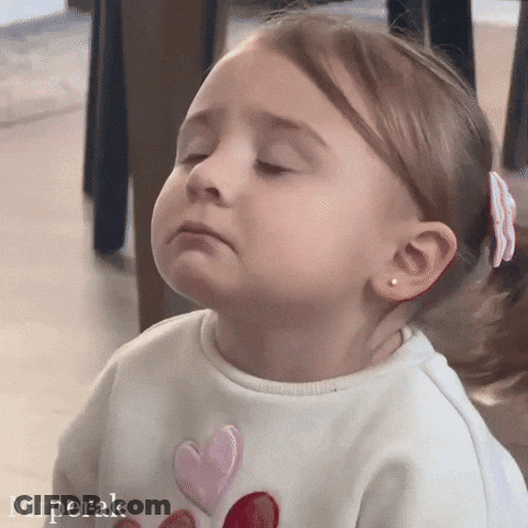 Little Girl In White Shirt With Hearts GIF