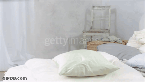 Little Girl Jumping With Pillow GIF