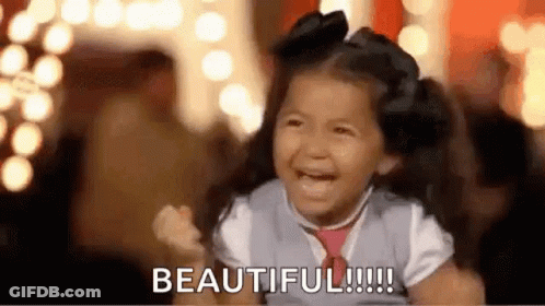 Little Girl Laughing Saying Beautiful With Fist In Air GIF
