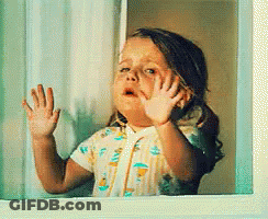 Little Girl Looking Out Window With Hands On Glass GIF