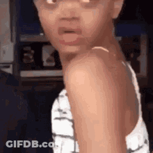 Little Girl Making Funny Face At Camera GIF