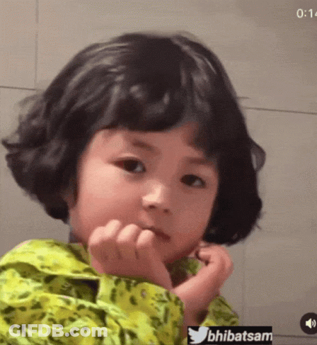 Little Girl Making Funny Face With Hand On Chin GIF