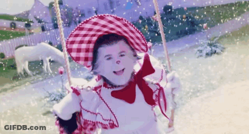 Little Girl On Swing With Red And White Hat GIF