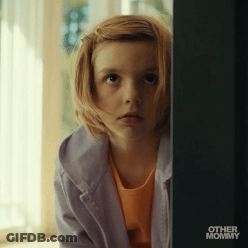 Little Girl Peeking From Behind Wall GIF