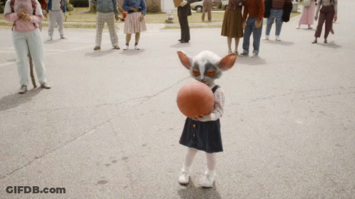 Little Girl Playing Basketball In Front Of Crowd GIF
