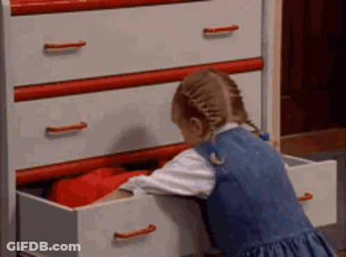 Little Girl Reaching Into Dresser Drawer GIF