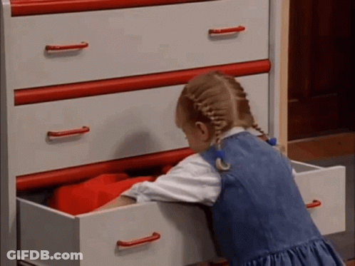 Little Girl Reaching Into Dresser Drawer GIF