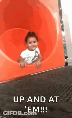 Little Girl Riding Down Orange Slide Saying Up And At Em GIF