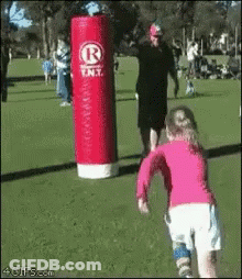 Little Girl Running Toward Red Punching Bag Saying R.N.T GIF