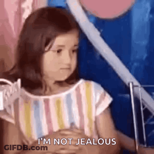 Little Girl Says I'm Not Jealous With Hands Folded GIF