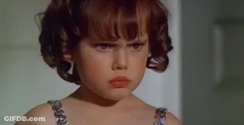 Little Girl Serious Wearing Bra GIF