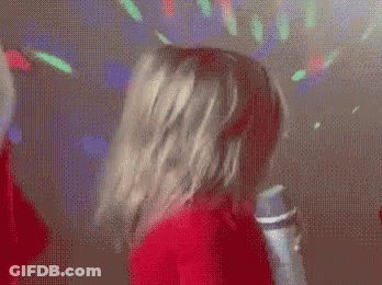 Little Girl Singing Into Microphone In Club GIF