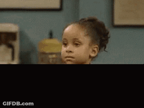 Little Girl Sitting In Living Room Asking Why GIF