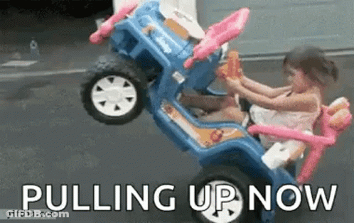 Little Girl Sitting In Toy Car Pulling Up Now GIF