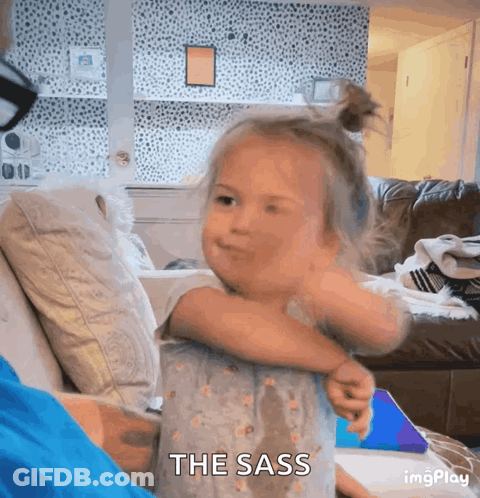 Little Girl Sitting On Couch With The Sass GIF