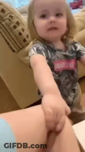 Little Girl Sitting On Woman's Lap Holding Hand GIF