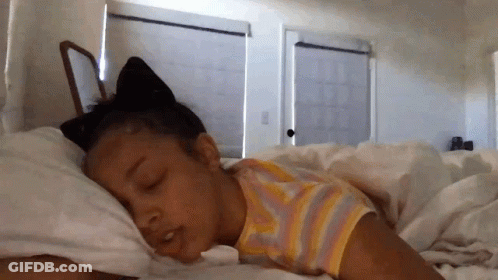 Little Girl Sleeping With Cat Ear On Head GIF