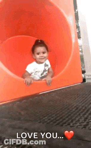 Little Girl Sliding Down Orange Slide With Love You GIF