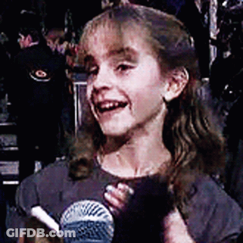 Little Girl Smiling Holding Microphone GIF
