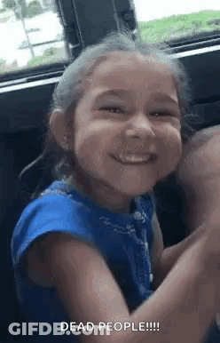 Little Girl Smiling Making Funny Face In Car GIF