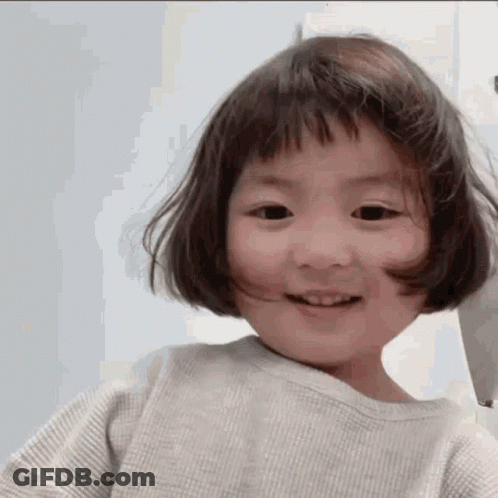 Little Girl Smiling With Short Hair And Bangs GIF