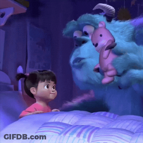 Little Girl Standing Next To Stuffed Animal In Bed GIF